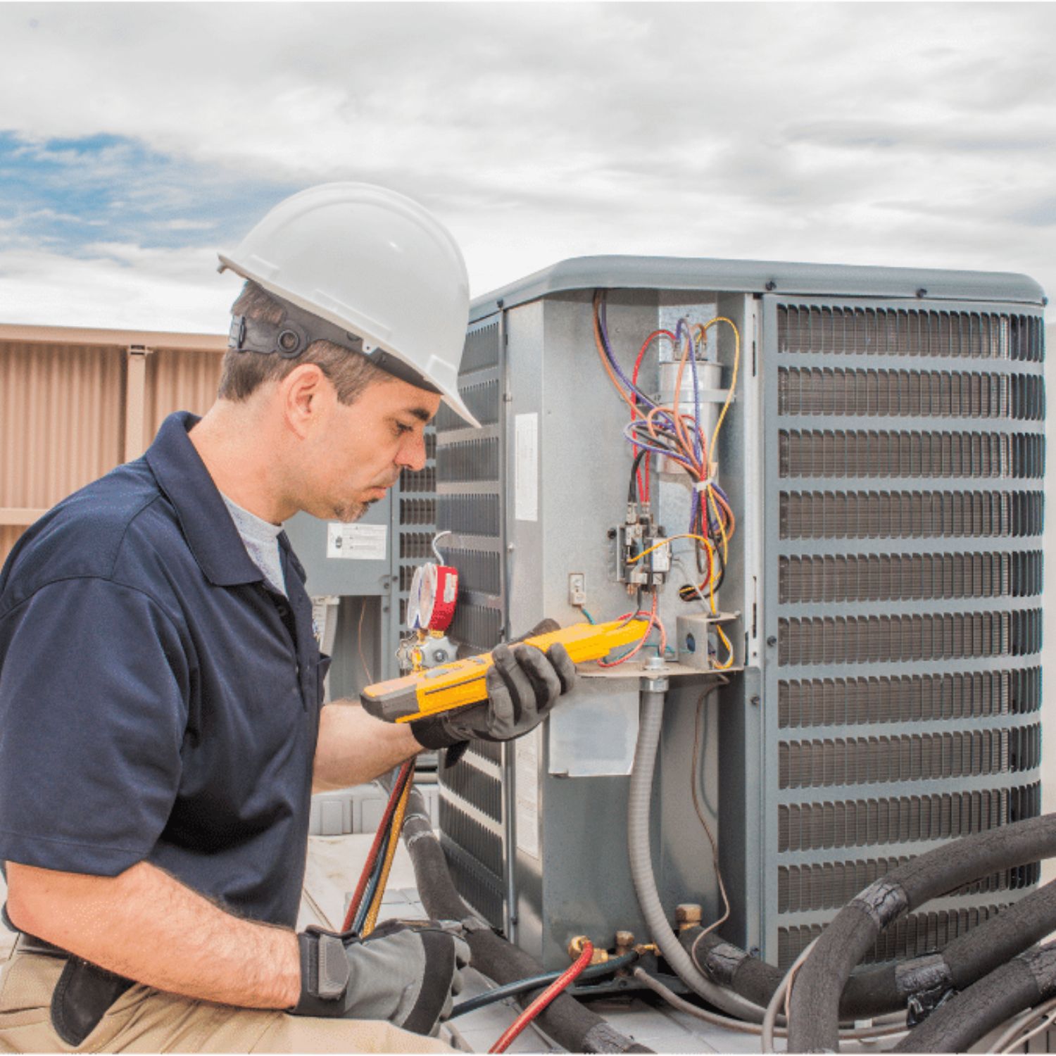 HVAC tech working on a condensing unit